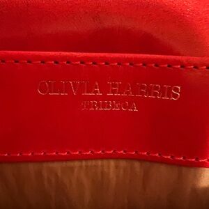 Olivia Harris, of Tribeca beautiful orange purse. Crossbody strap